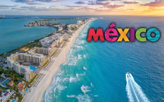 Aerial view of Cancun with a large “Mexico” sign overlooking the turquoise ocean during FIFA World Cup 2026.